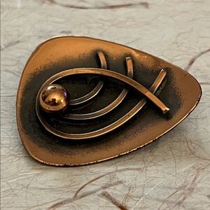 Vintage modernist mid century oxidized copper brooch with curved lines and ball